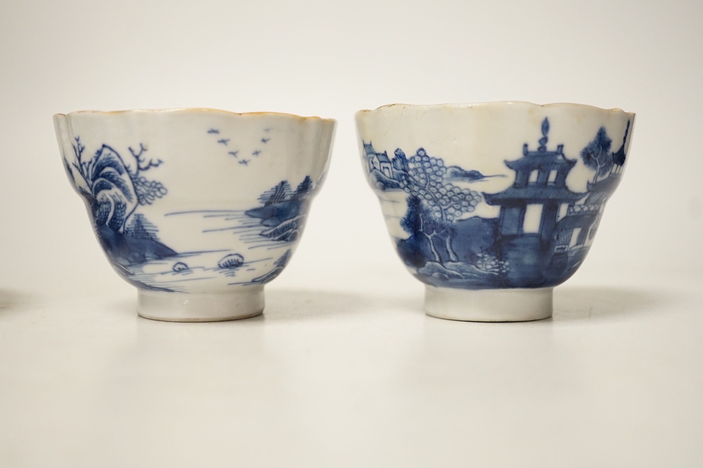 Two 19th century Chinese blue and white dishes and two 18th century tea bowls, largest 23cm diameter